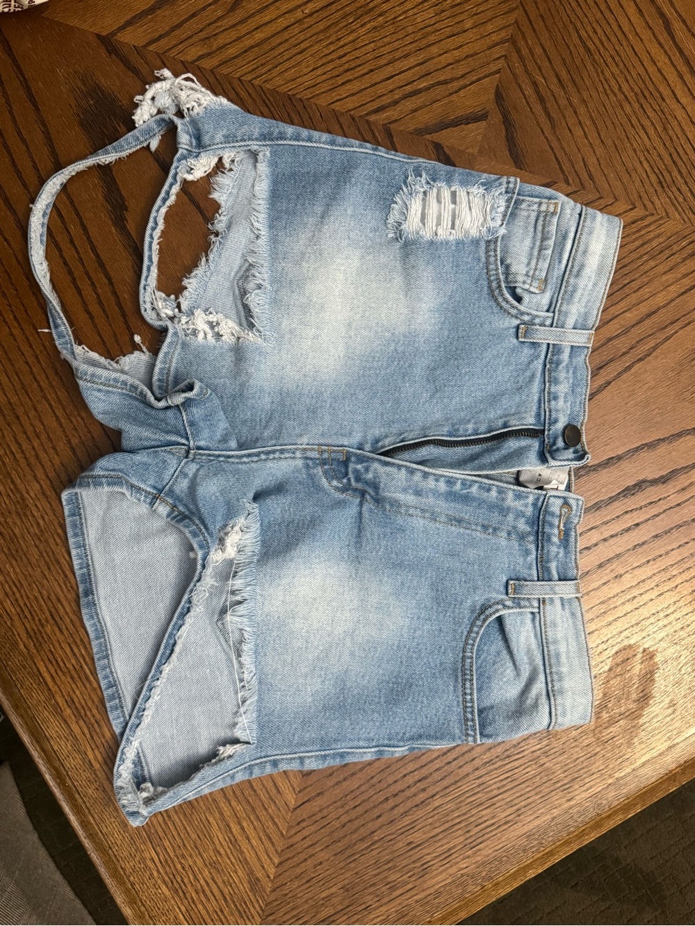 Vibrant Light Wash Distressed Denim Cutoff Shorts